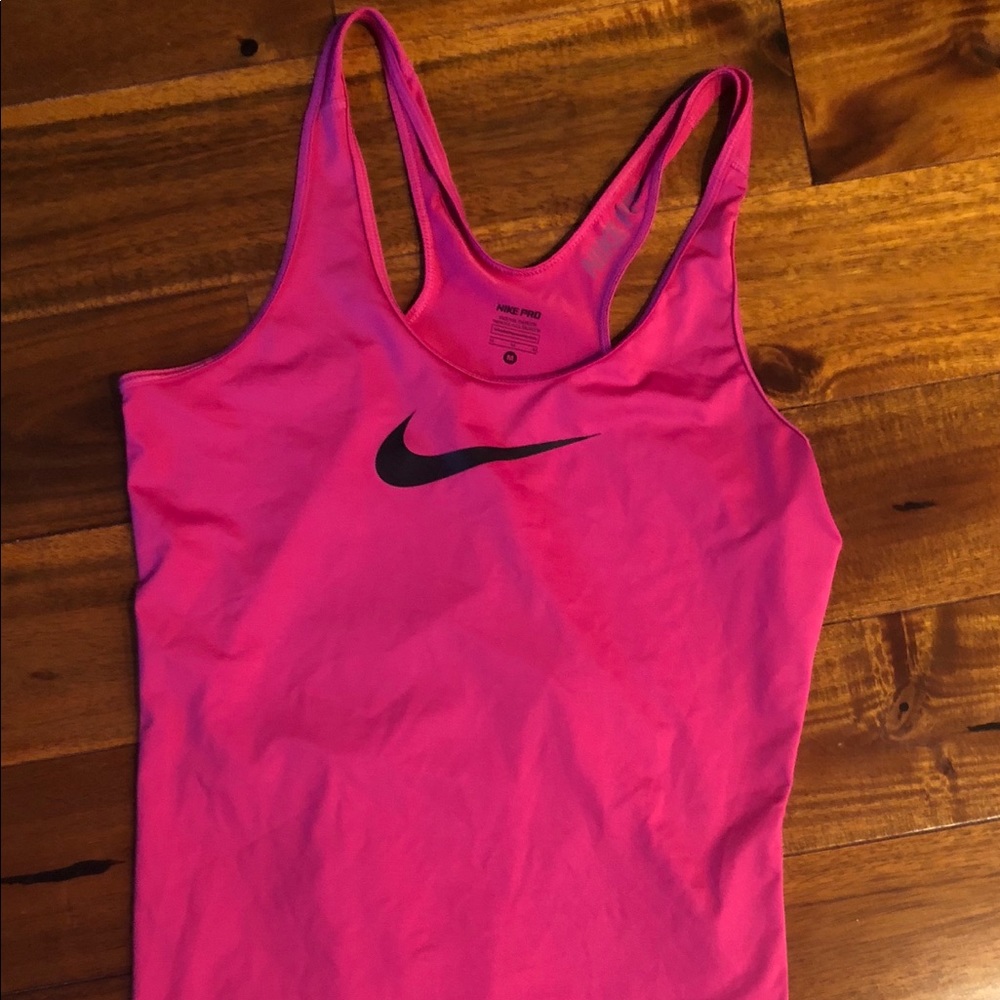 Pink woman’s Nike Pro tank